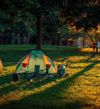 a tent is set up in a grassy field
